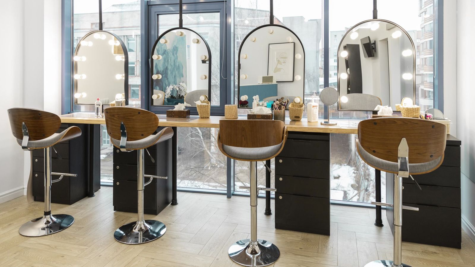 Bright modern beauty salon with styling chairs and mirrors
